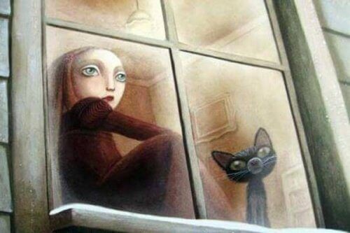 tyttö ja kissa istuvat ikkunalaudalla