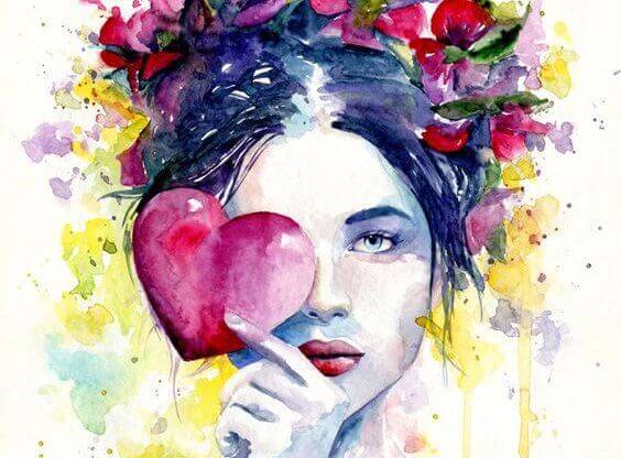 nainen pitelee sydäntä